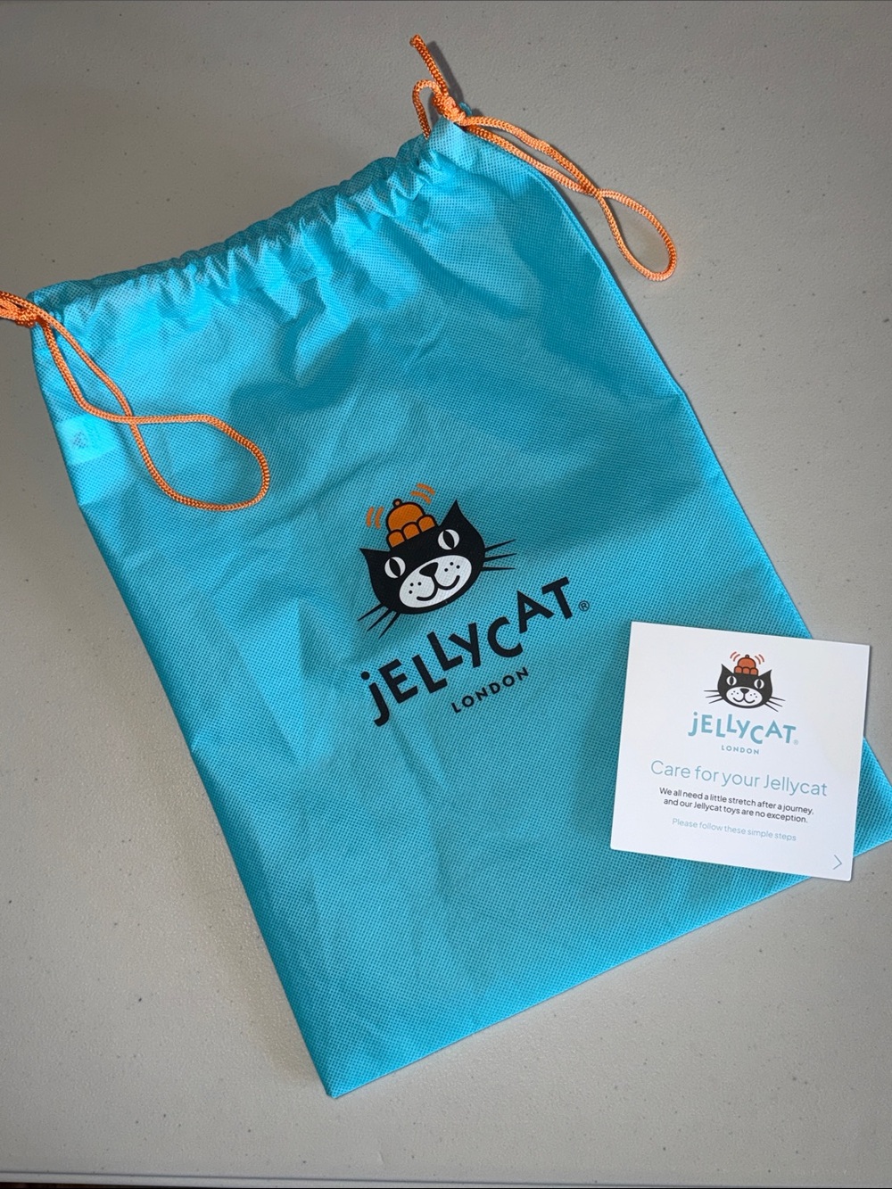 Jellycat Turquoise Drawstring Toy Bag with Orange Cords